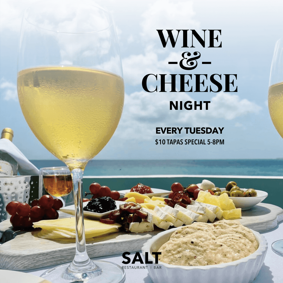 Wine and Cheese Night flyer with white wine glasses and a platter by the ocean at The Morgan Resort Spa Village